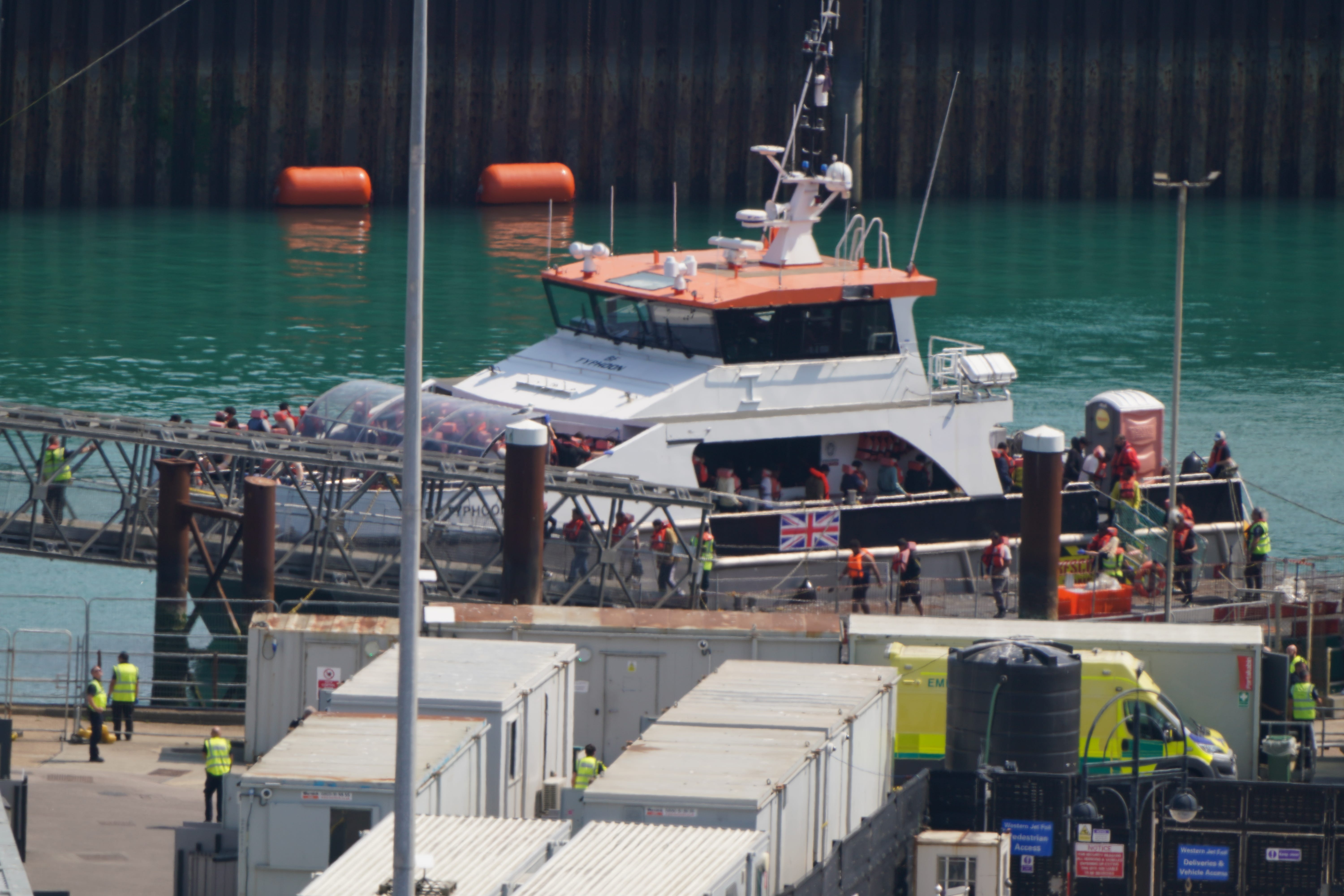 A group of people thought to be migrants are brought in to the Border Force compound in Dover, Kent, from a Border Force vessel following a small boat incident in the Channel (Gareth Fuller/PA)