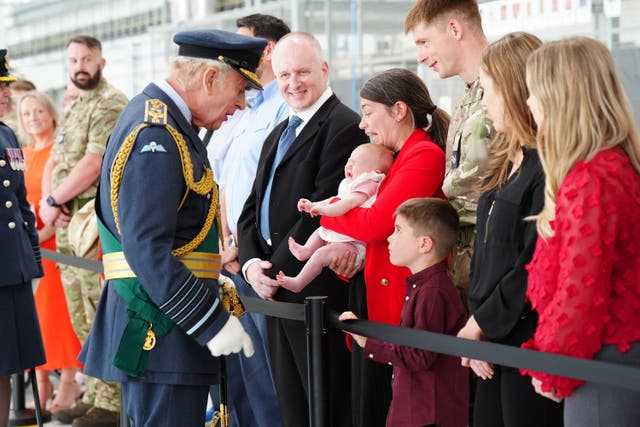 The King meets RAF service members and their families during a visit to RAF Lossiemouth (Jane Barlow/PA)