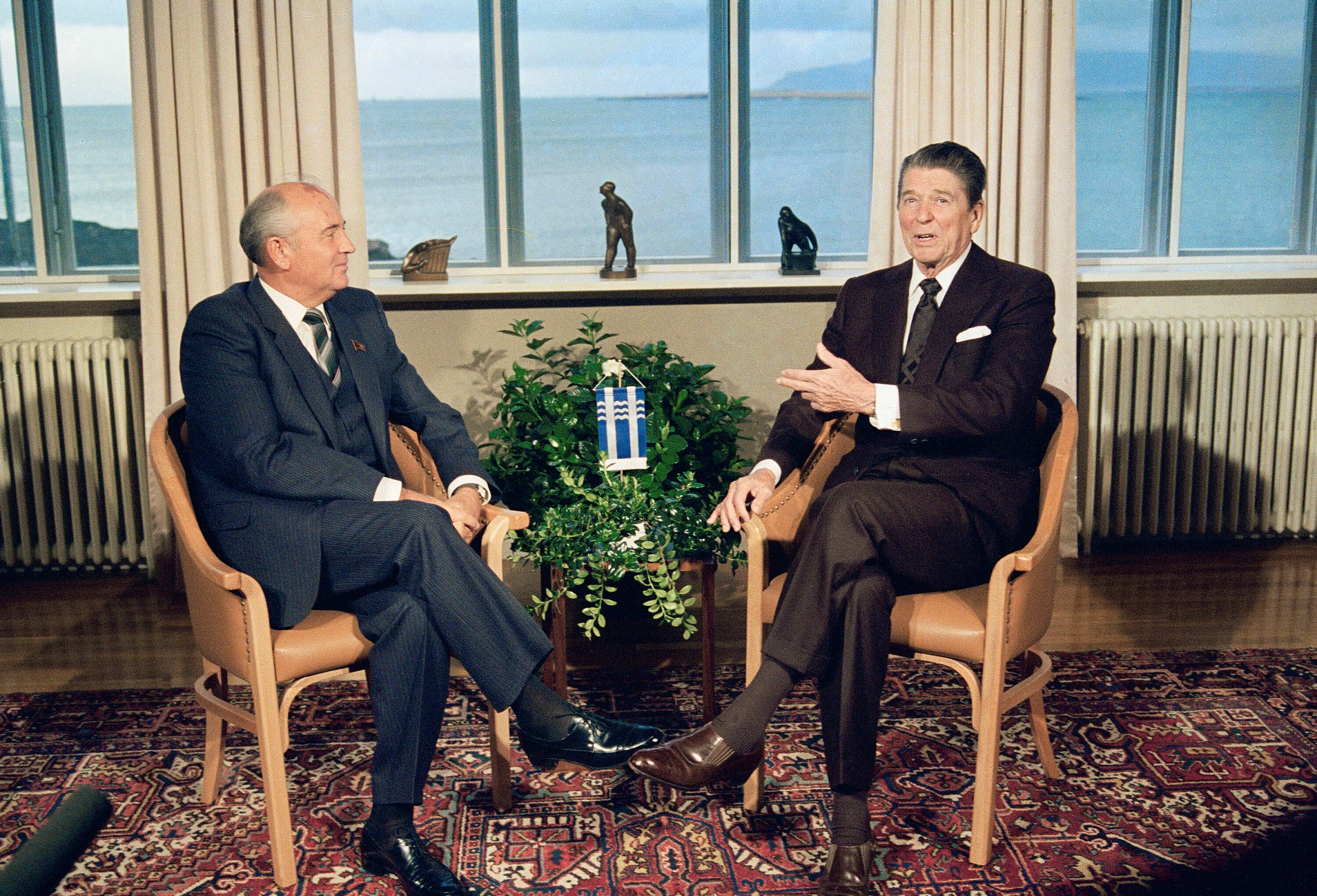 Soviet leader Mikhail Gorbachev and US President Ronald Reagan sit down together inside the Hofdi in Reykjavik, Iceland, in 1986
