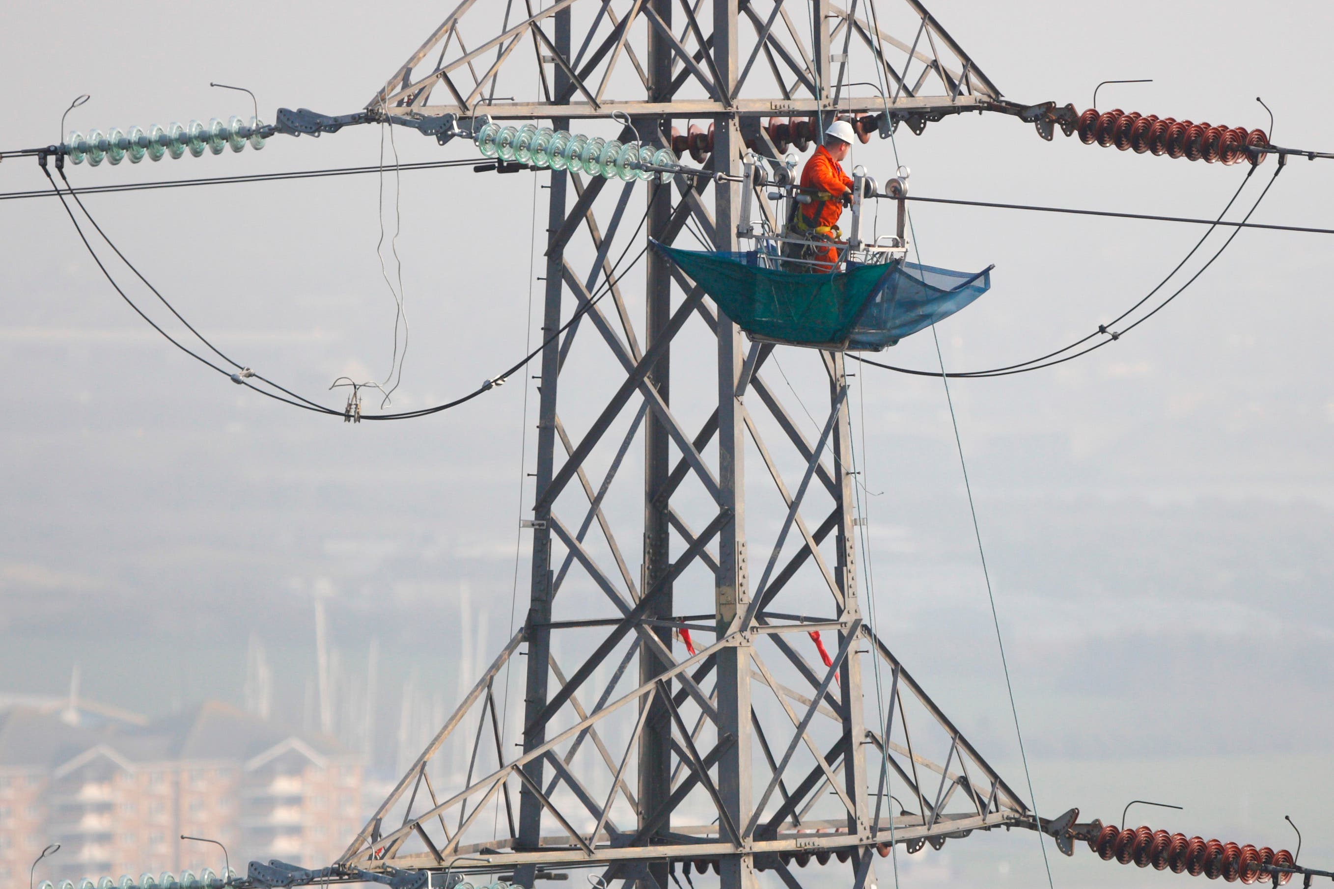 Engineers work on power lines (Chris Ison/PA)
