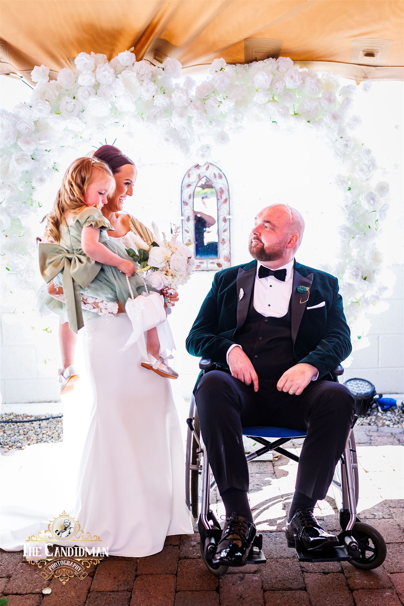 Michaela and Dean on their wedding day with their daughter, Sloane