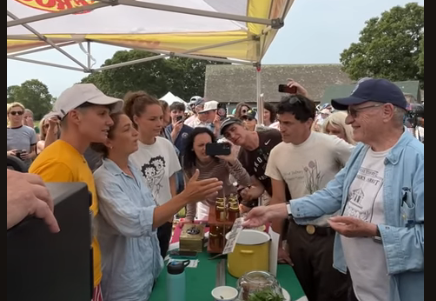 Alan Dershowitz unsuccessfully attempts to purchase pierogi from an unwilling vendor at a Martha's Vineyard market.