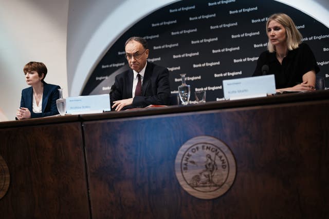Governor of the Bank of England, Andrew Bailey, is joined by the deputy governor for monetary policy, Claire Lombardelli (left), and the head of media and stakeholder engagement for the bank, Katie Martin (right), during the Bank’s financial stability report press conference (Jordan Pettitt/PA)