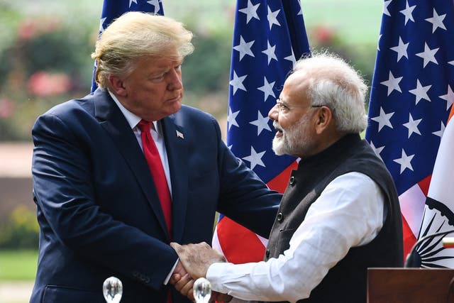 <p>US President Donald Trump (L) shakes hands with India's Prime Minister Narendra Modi</p>