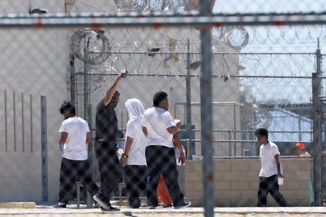 <p>ICE detainees at an immigration detention facility run by private prison company GEO group in Adelanto, California, which has been accused of ‘neglecting and mistreating’ its residents</p>