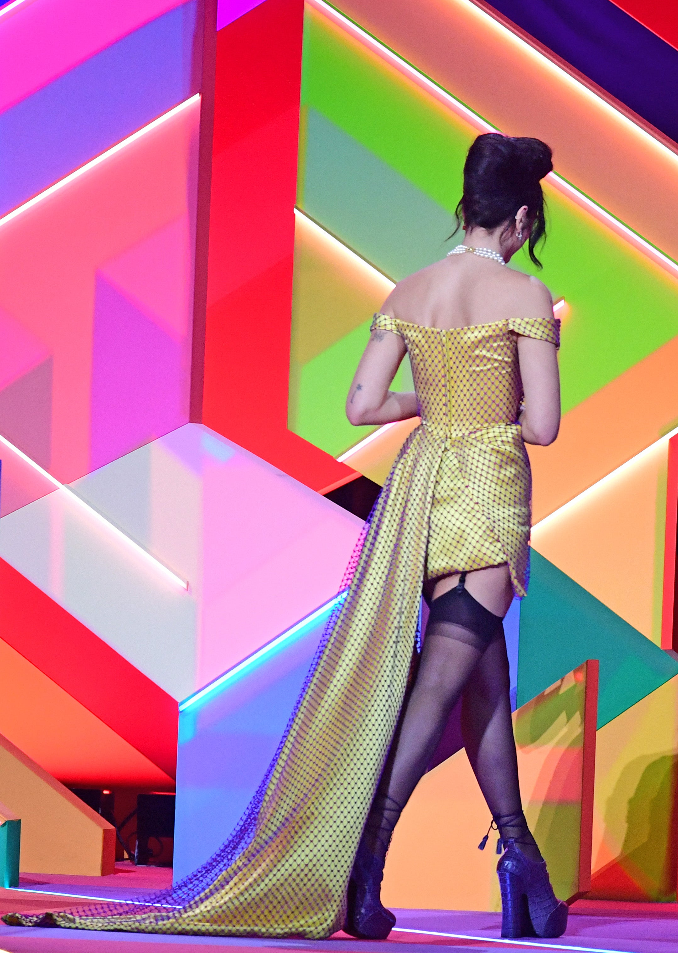 Dua Lipa leaves the stage after collecting the award for Best Album