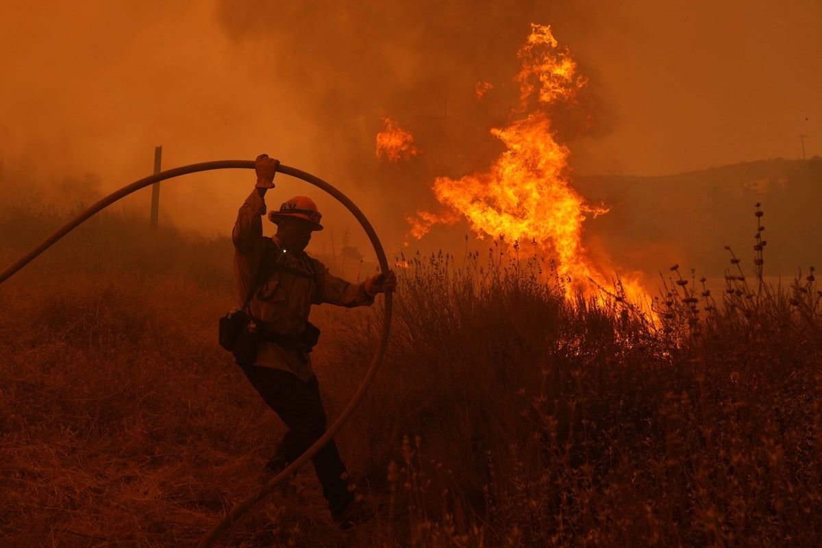 Fast-growing brush fire forces thousands to evacuate north of Los ...