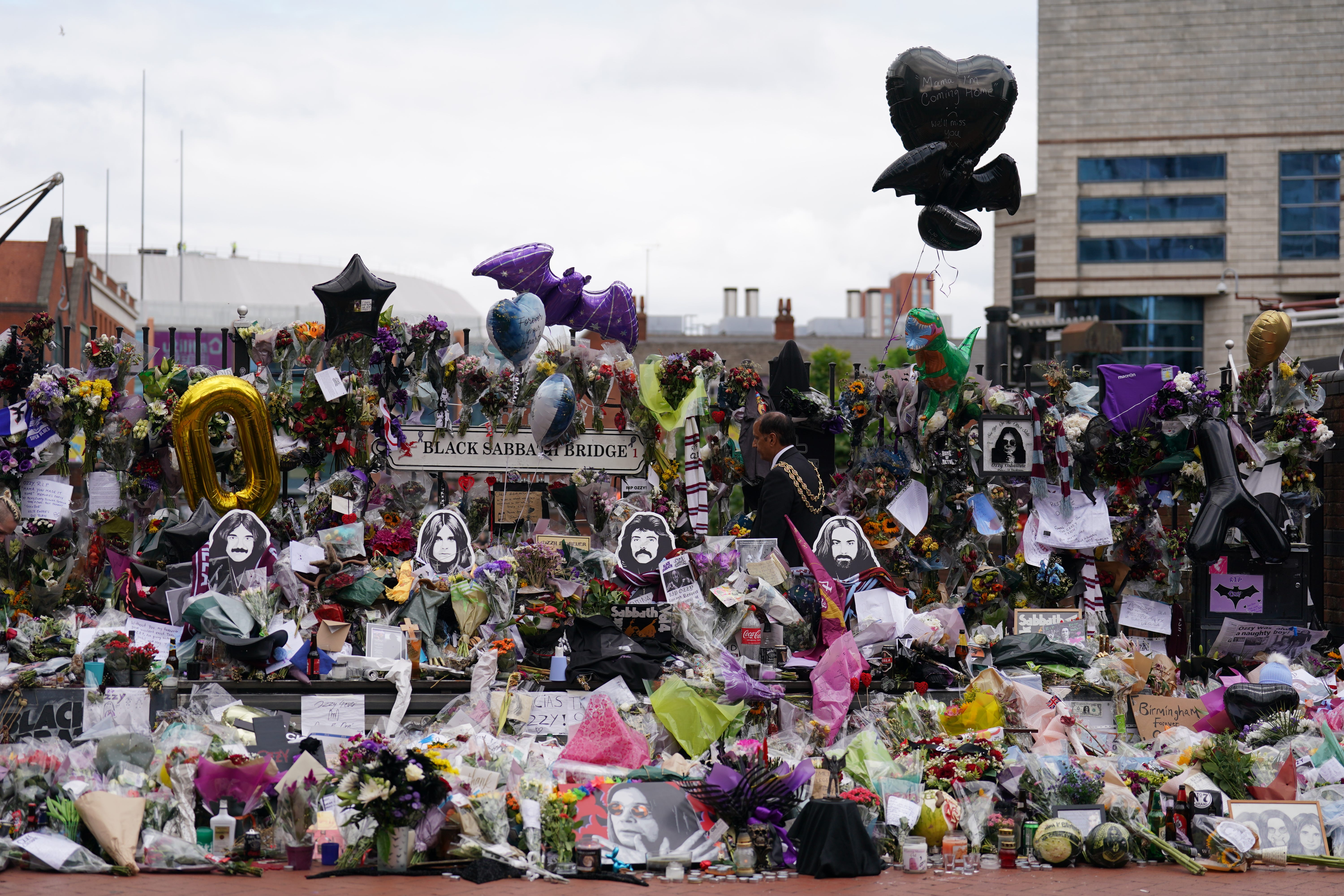 Thousands of flowers and tributes were left at Black Sabbath bench on Broad Street in Birmingham after Ozzy Osbourne’s death aged 76 (Joe Giddens/PA)