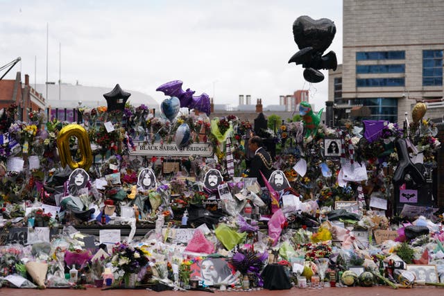 Thousands of flowers and tributes were left at Black Sabbath bench on Broad Street in Birmingham after Ozzy Osbourne’s death aged 76 (Joe Giddens/PA)