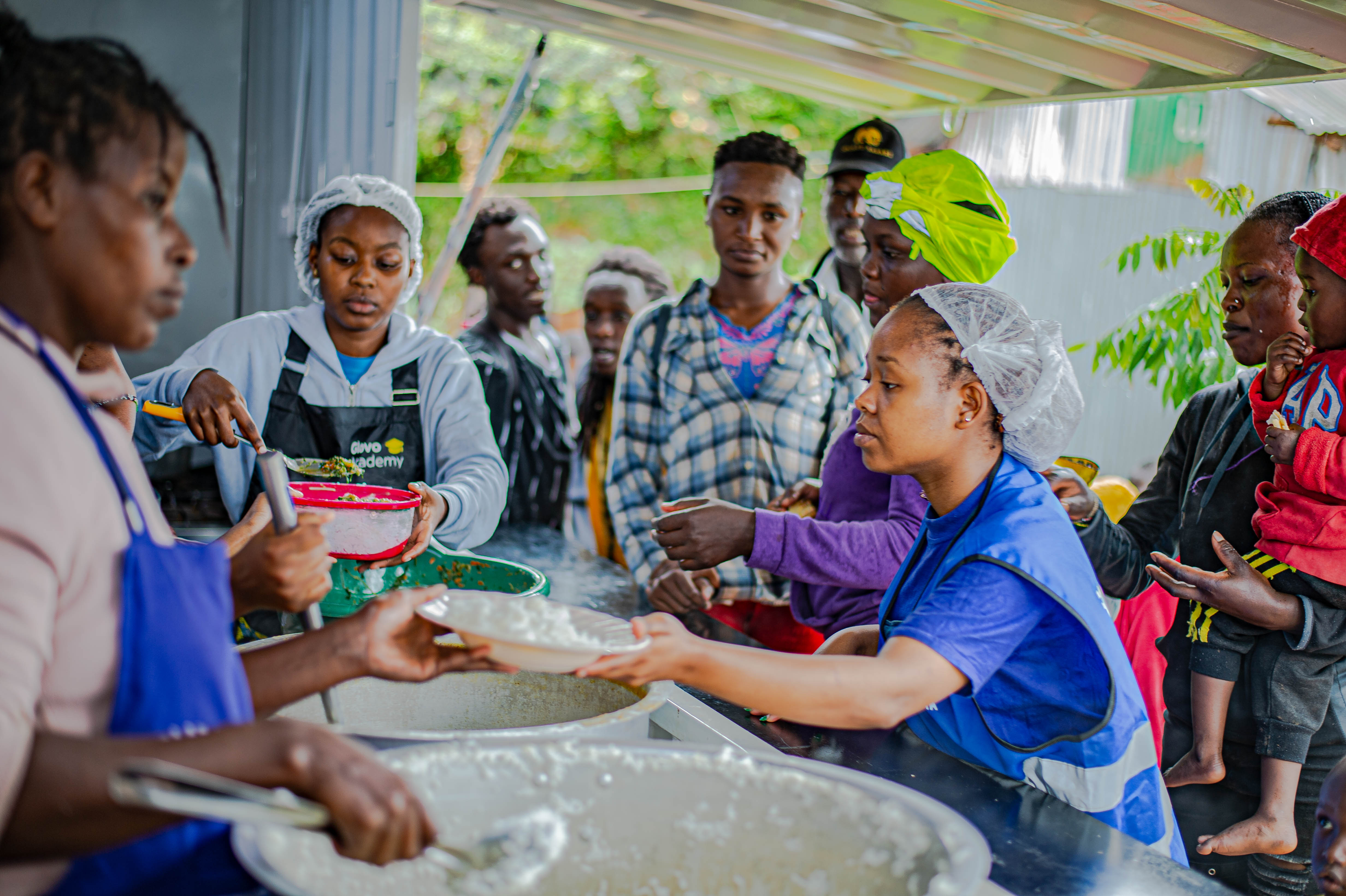Dishes are served up at a community kitchen run by Food Banking Kenya