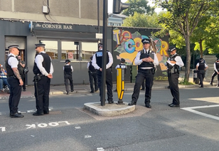 Police outnumber anti-migrant protesters outside Islington hotel 