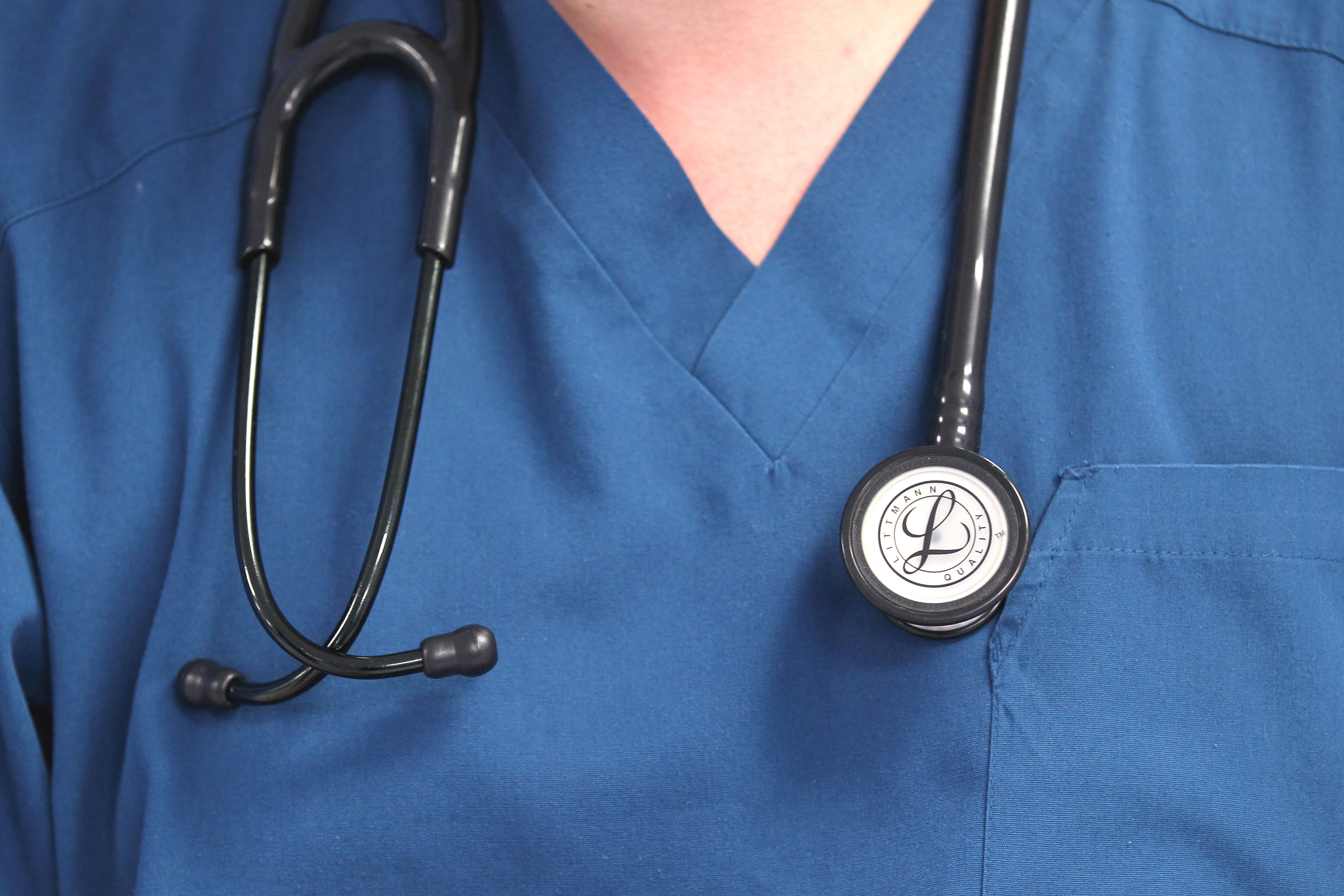 File photo dated 15/08/14 of a Doctor holding a stethoscope at the Royal Liverpool University Hospital, Liverpool.