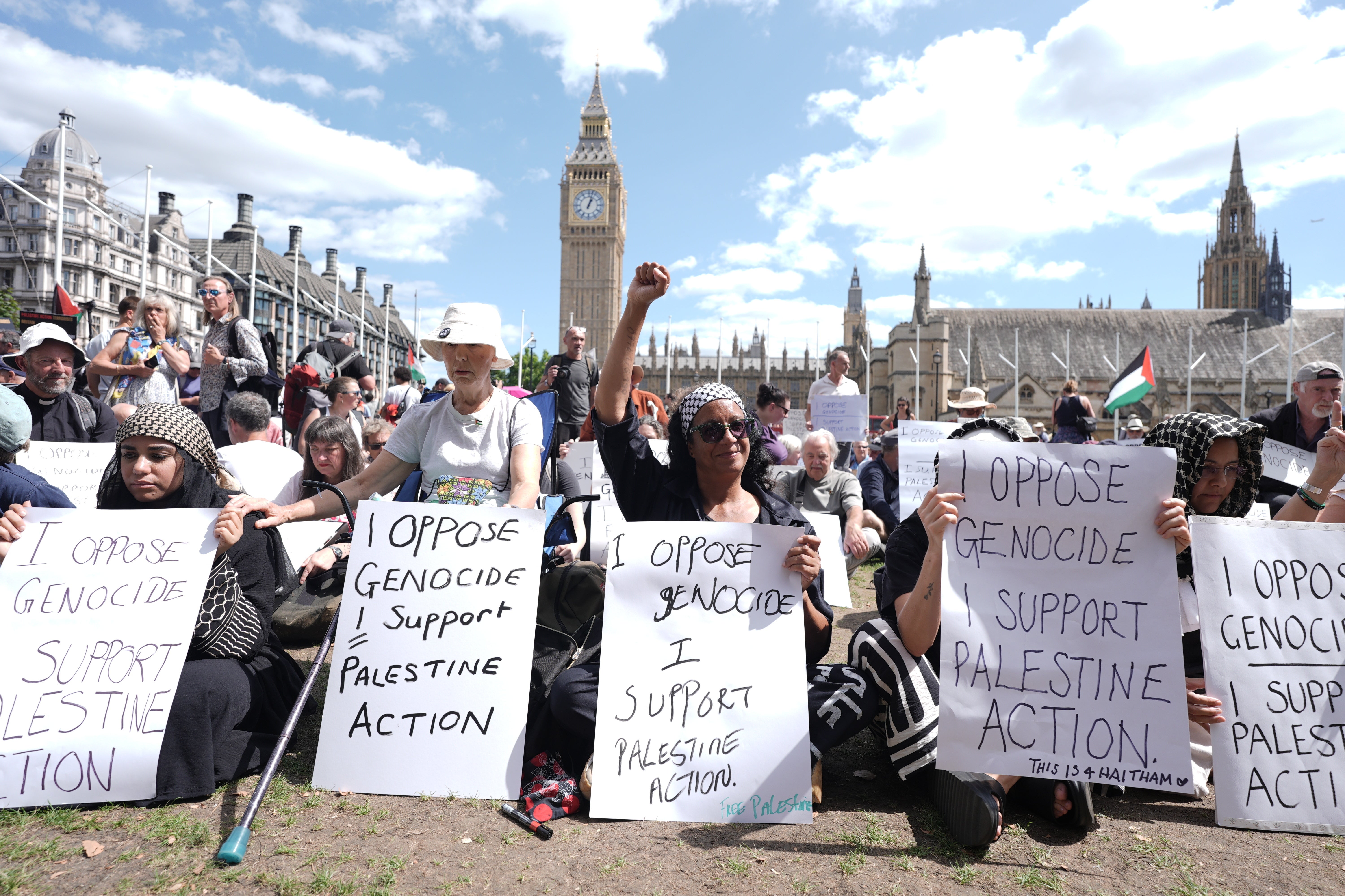 The protesters participate in a collective action at Parliament Square, Westminster
