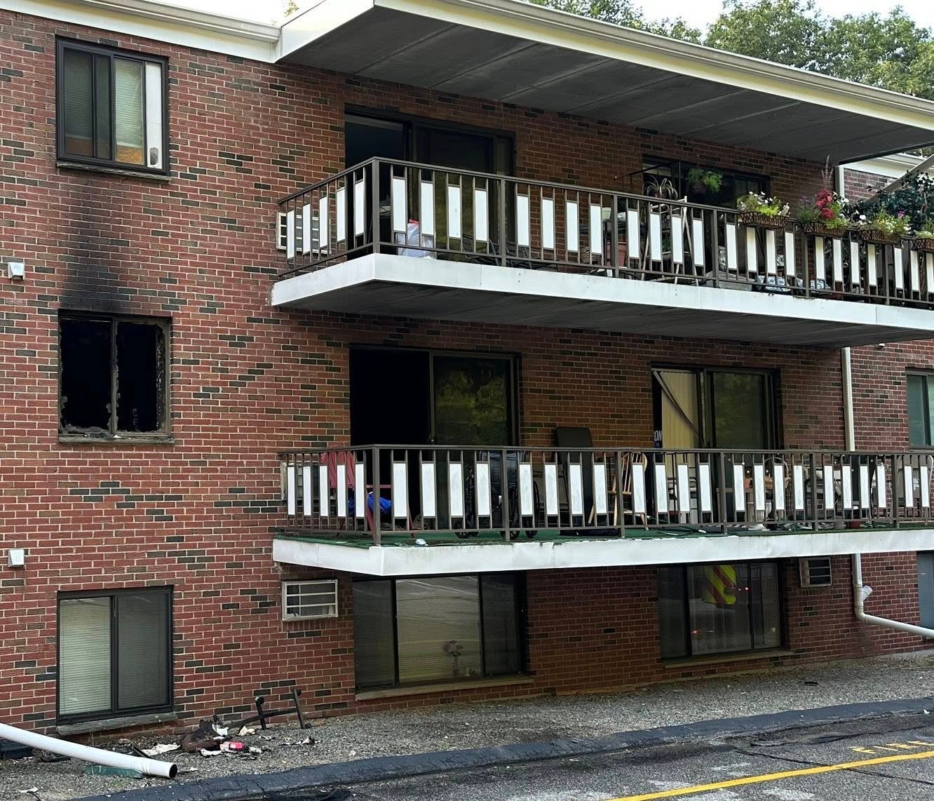 Two cousins rescued an elderly, bedridden woman from a fire in her Massachusetts apartment (pictured)