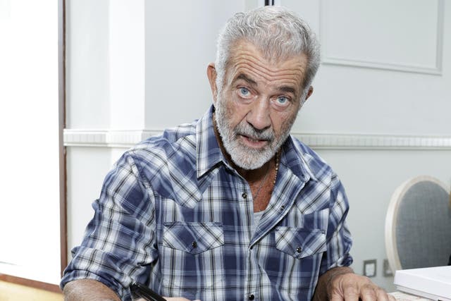 Mel Gibson signs posters in aid of the Irish Equity Support Fund (Conor O Mearain/PA)