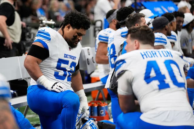 <p>Detroit Lions players kneel on the bench while safety Morice Norris is injured against the Atlanta Falcons during the second half of an NFL preseason football game Friday, Aug. 8, 2025, in Atlanta</p>