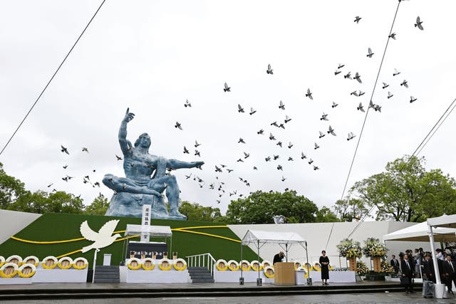 <p>Doves are released over the Peace Statue during a ceremony to mark the 80th anniversary of the US atomic bombing at the Peace Park in Nagasaki</p>