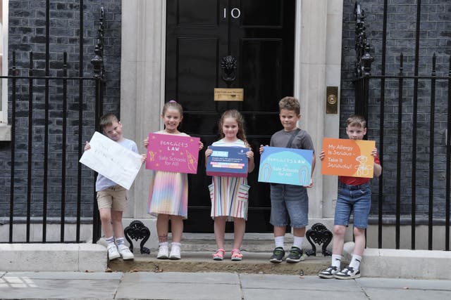 A group of children, including Etta Blythe (third left) , the sister of Benedict Blythe, delivered a petition to Downing Street (Stefan Rousseau/PA)