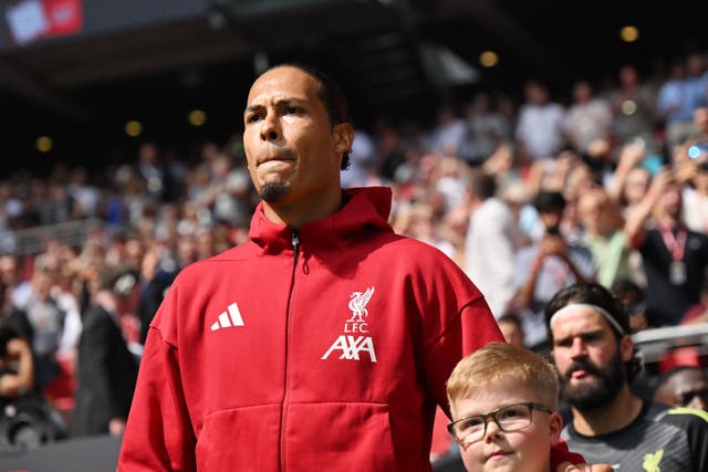 <p>Virgil van Dijk leads Liverpool out at Wembley</p>