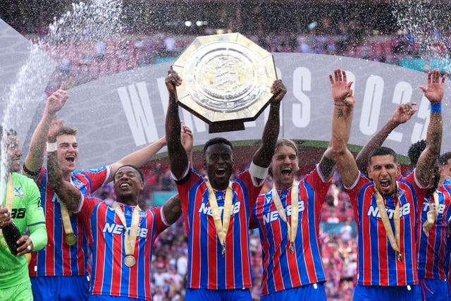 Crystal Palace’s Marc Guehi lifts the shield with team-mates (John Walton/PA)