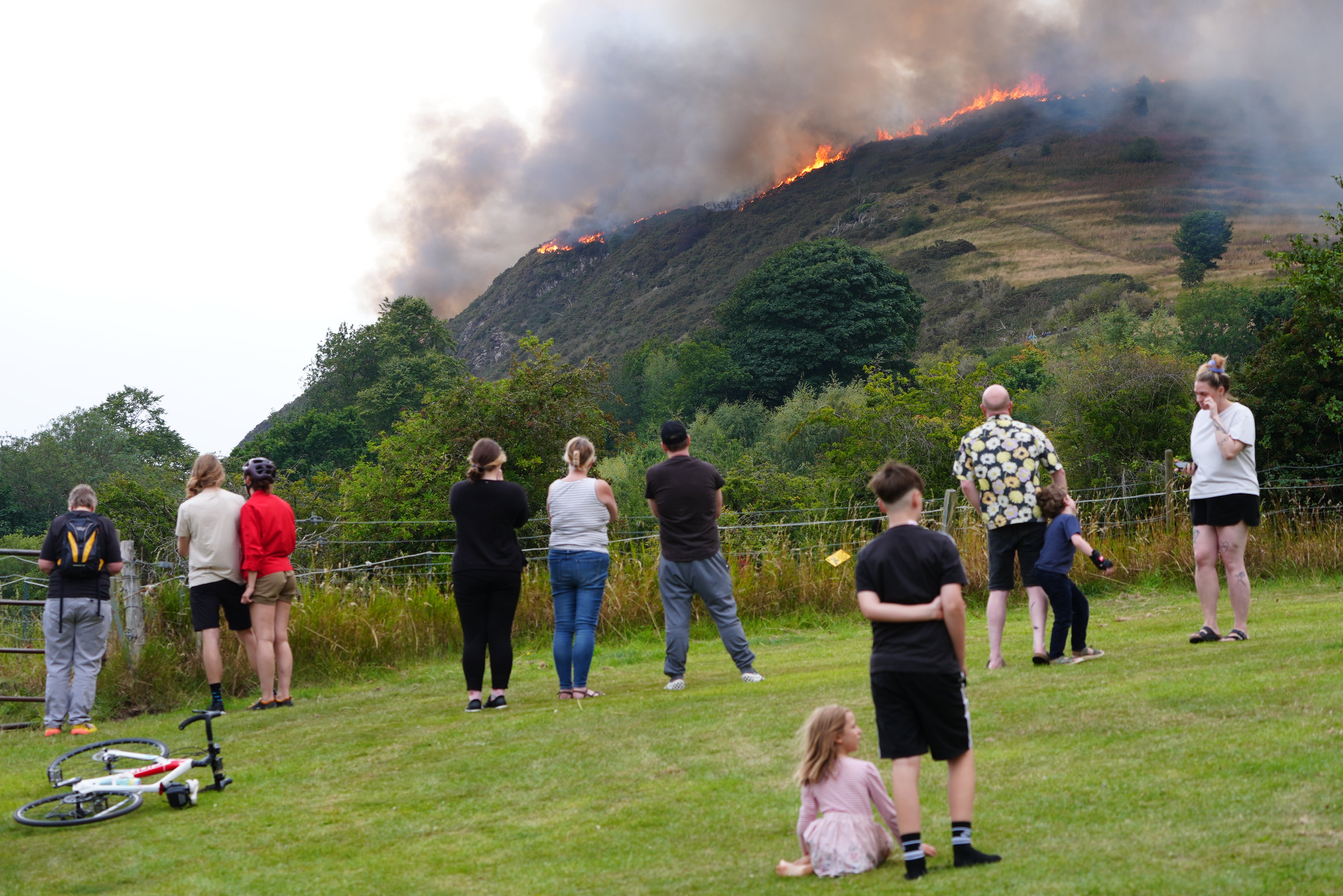Members of the public watch the blaze