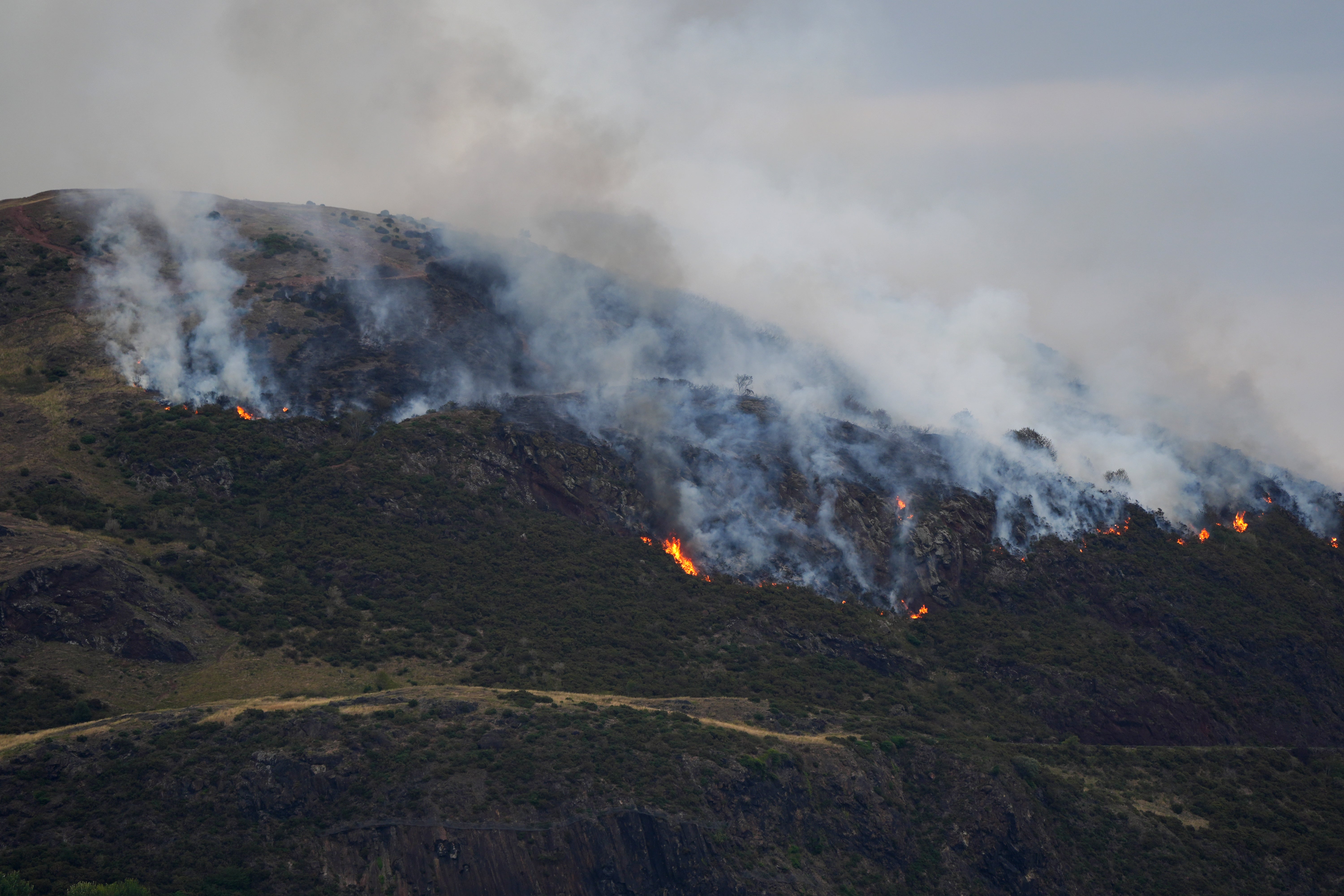 Flames and smoke on Arthur's seat in Holiroad Park in Edinburgh
