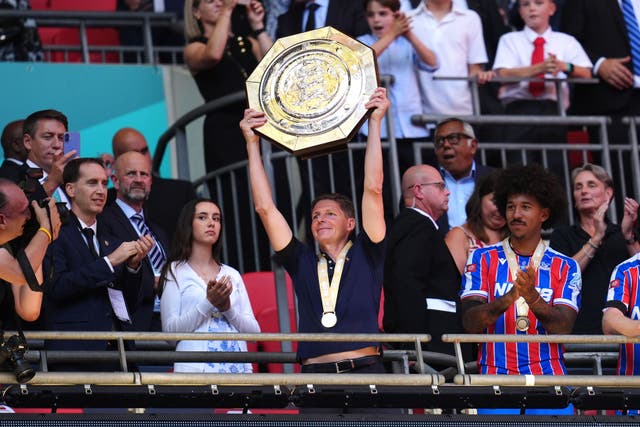 Oliver Glasner lifts the shield with players following Palace’s victory (John Walton/PA)