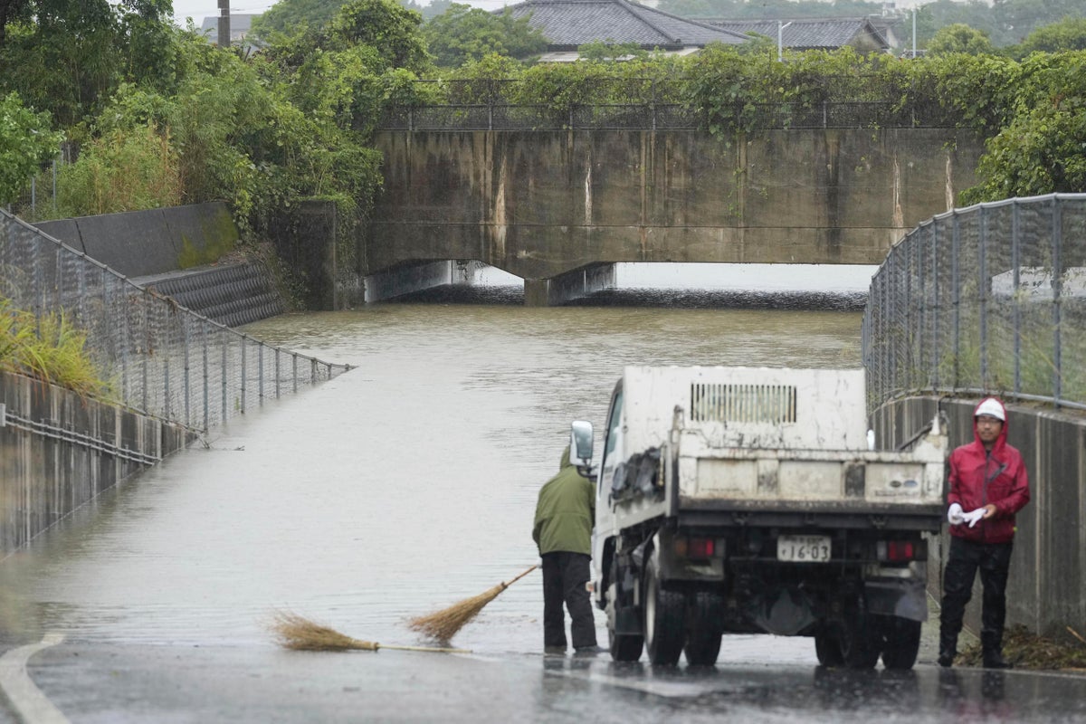 Heavy rains in southern Japan cause flooding and mudslides, and leave several people missing