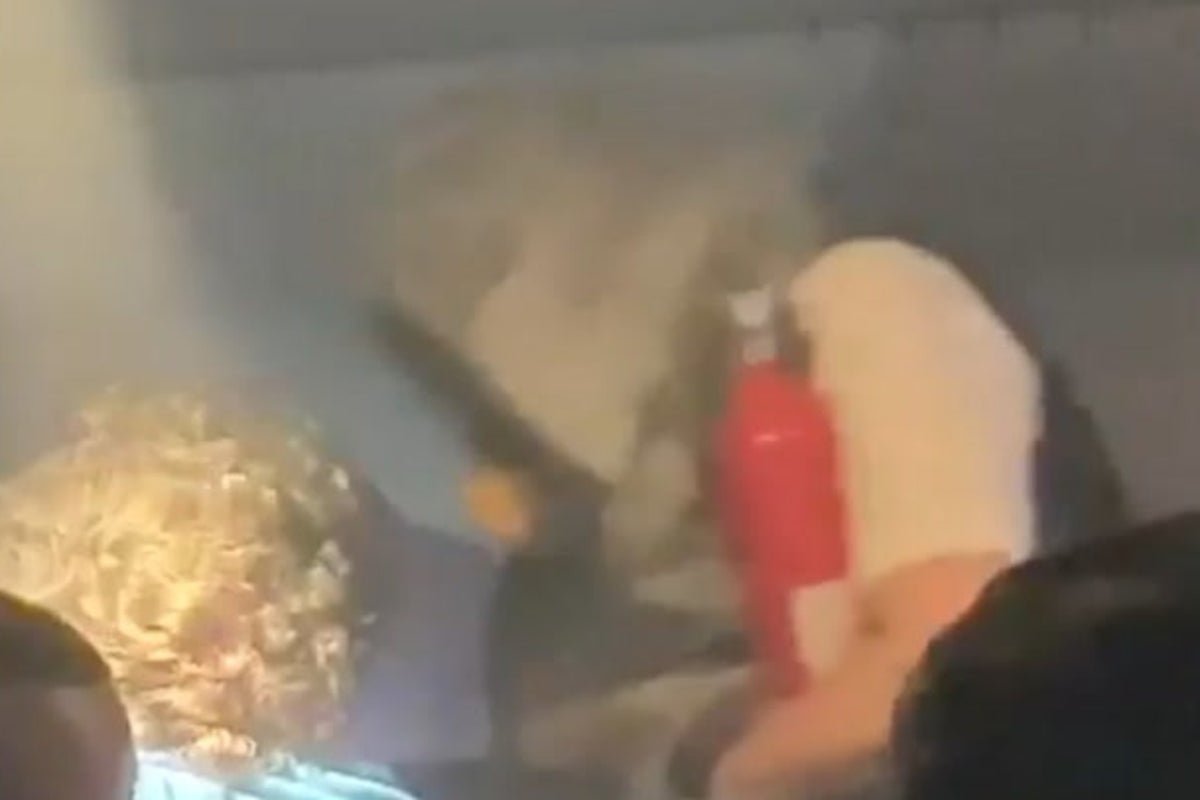 Terrifying moment plane cabin fills with smoke after power bank bursts into flames
