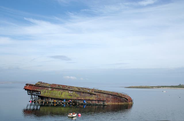 <p>A half-submerged wreck in Scapa Flow, Orkney Islands</p>