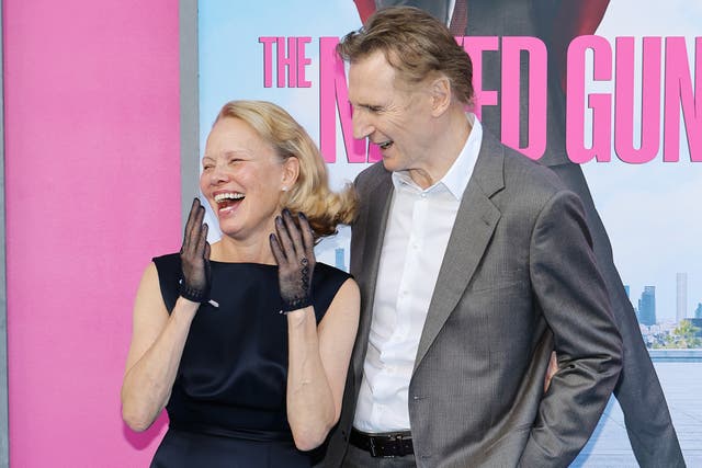 <p>Pamela Anderson and Liam Neeson have been called 'dirty flirts' on The Naked Gun press tour</p>