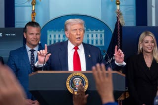 Donald Trump addresses reporters at a press briefing in the White House