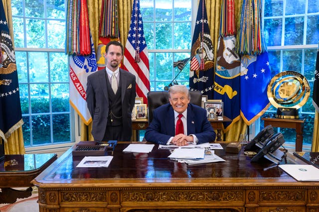<p>Economist E.J. Antoni stands next to Donald Trump in the Oval Office</p>