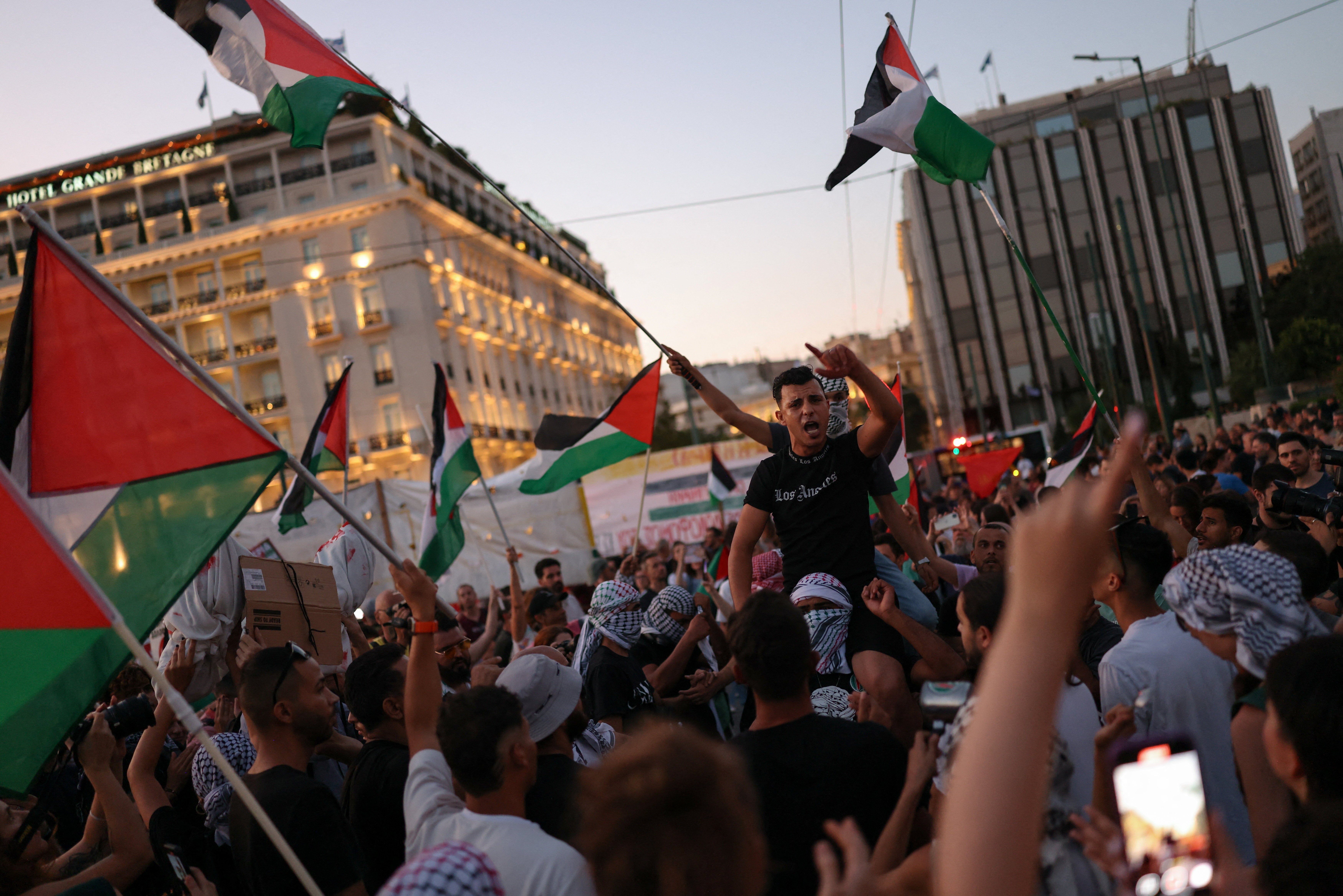 Pro-Palestinian protesters shout slogans at Syntagma Square during a protest, part of demonstrations taking place across Greece, in Athens, August 10, 2025. REUTERS/Stelios Misinas