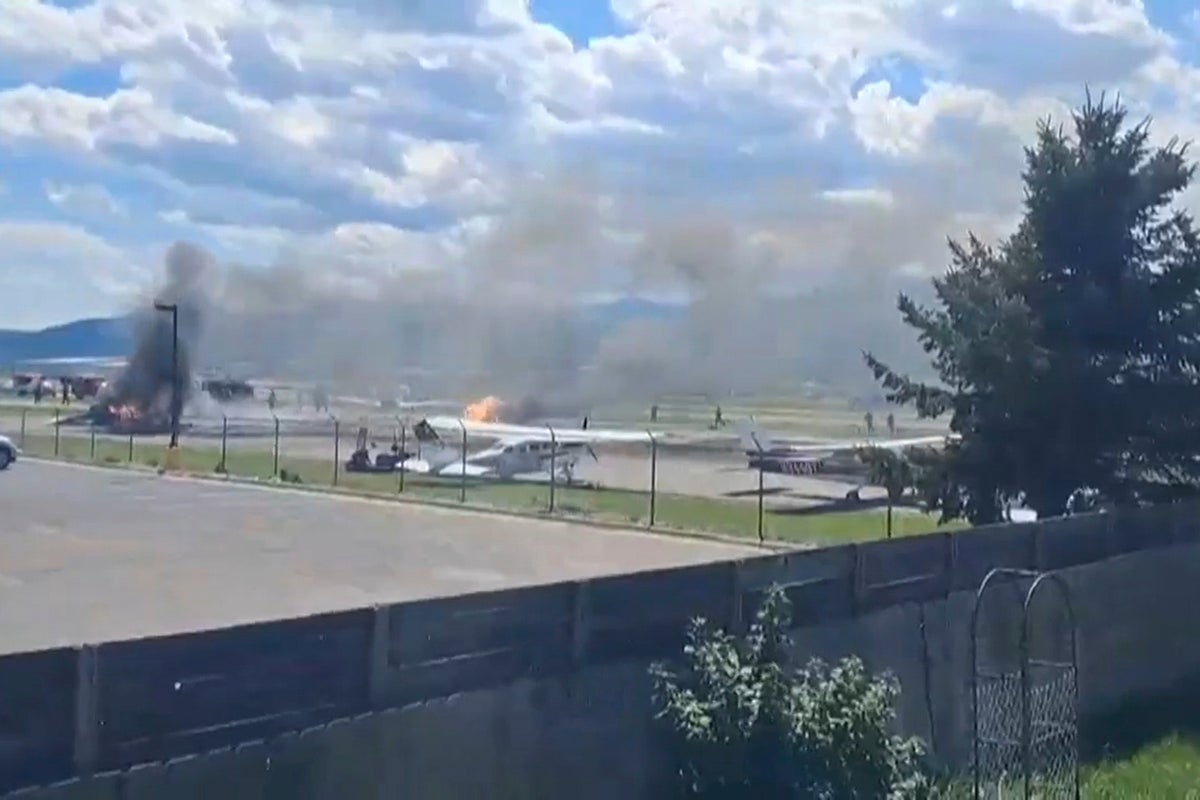 Plane crashes into parked aircraft while landing at Montana airport, sparking fire