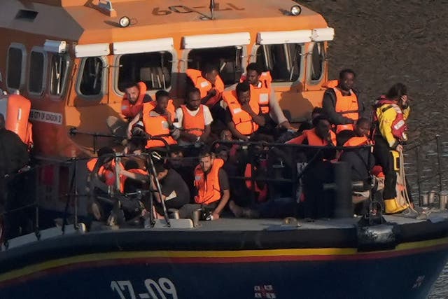 A group of people thought to be migrants being brought to shore in Dover on Monday by the RNLI (Gareth Fuller/PA)
