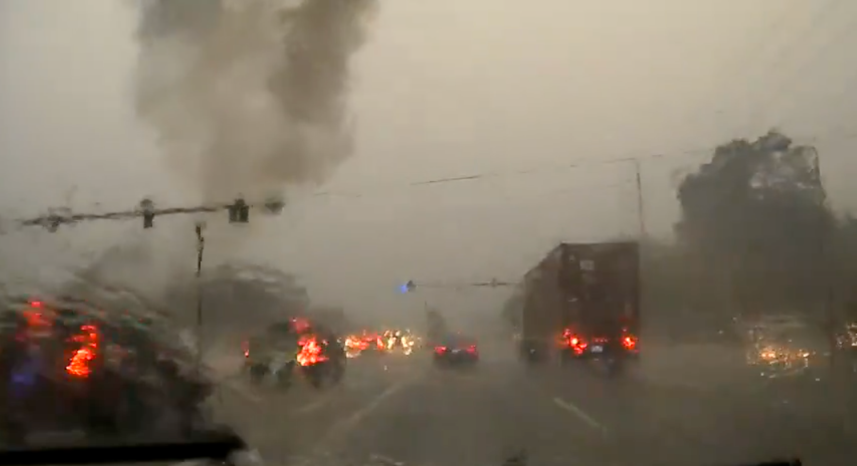 A black smoke cloud then drifts across the highway