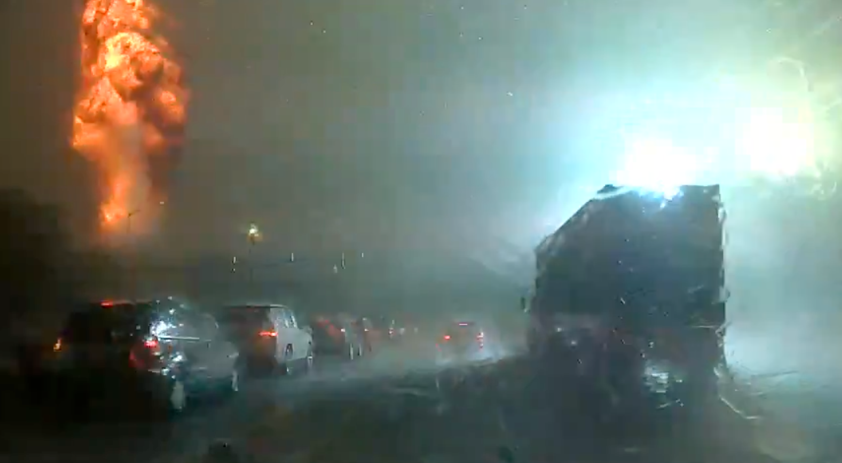 A plume of smoke and flames erupts after the lightning strike