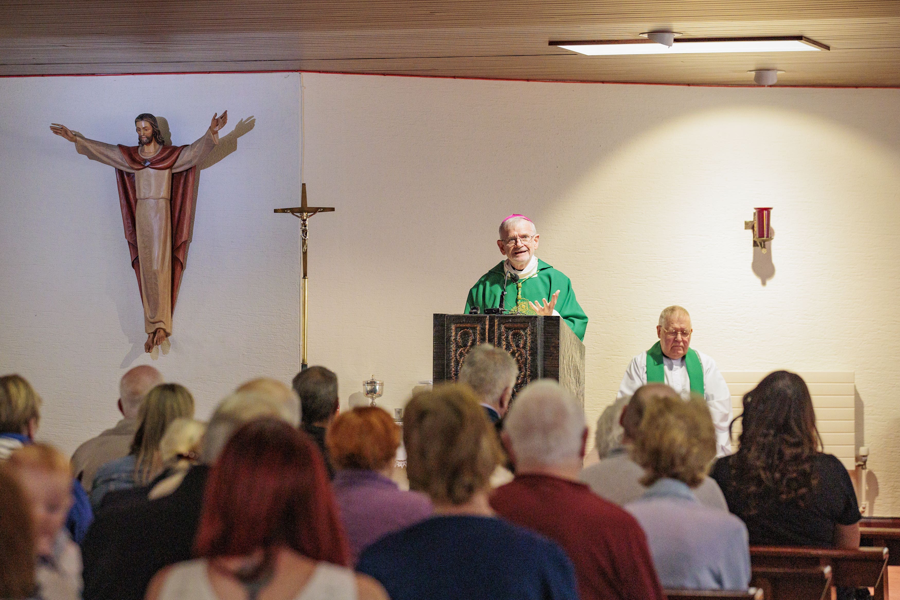 Bishop Alan McGuckian leads a mass at St Colmcille’s Church in Downpatrick, Co Down, following the sudden death of Stephen Brannigan and an attack on priest Father John Murray in the town (Liam McBurney/PA)
