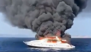 Watch as huge superyacht engulfed in flames off Ibiza coast
