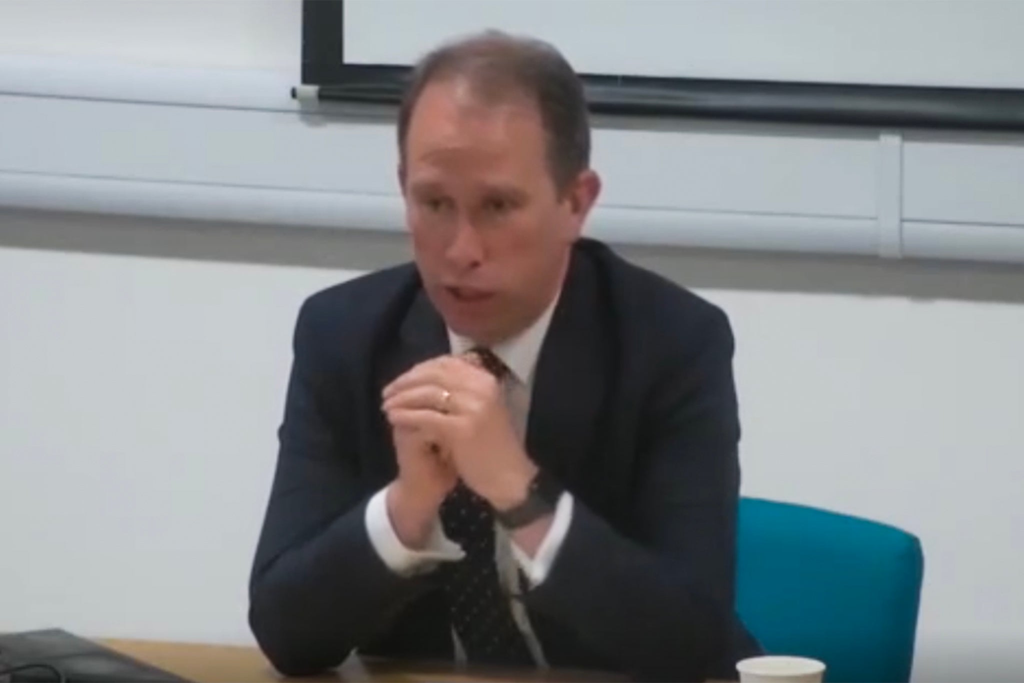 Thames Valley's conservative police and criminal commissioner Matthew Barber emerges before the council meeting
