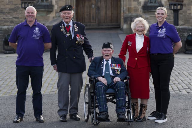 Second World War veterans Eugeniusz Niedzielski, 101, Don Turrell, 100, and Dorothea Barron, 100, met vice chairman Paul Cook (left) and fundraiser and safeguarding officer Keely Allen (right) (Jane Barlow/PA)