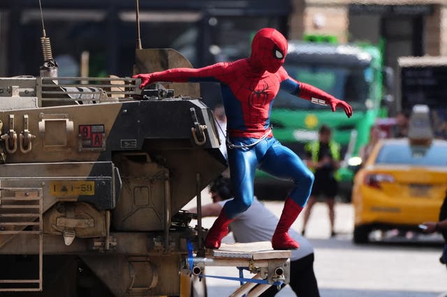 <p>A person in a Spider-Man suit during filming on Hutcheson Street in Glasgow for the latest film in the Spider-Man franchise, Spider-Man: Brand New Day</p>