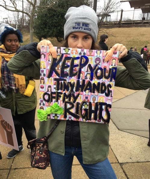 Malle, now a mother of two, attended the Women’s March in Washington, D.C. to protest Trump’s first inauguration. ‘Keep Your Tiny Hands Off My Rights,’ the placard Malle is holding reads.