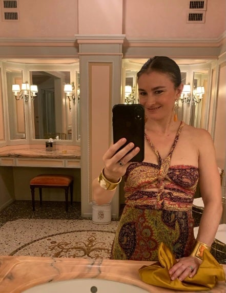 A glammed-up photo of Malle taking a selfie in a grandiose-looking bathroom is captioned: ‘Back in my pajamas watching Miss Marple but still thinking about the time I dressed up THREE nights in a row!’