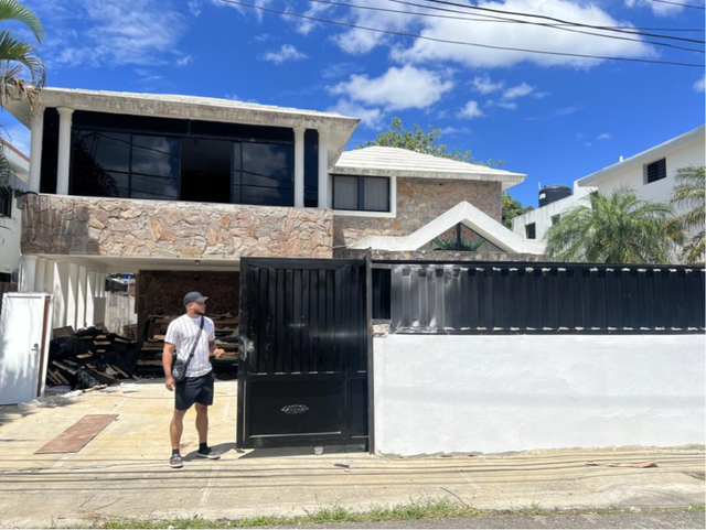 <p>One of the defendants outside of a call center, which were typically run out of homes in the Dominican Republic, according to federal prosecutors</p>