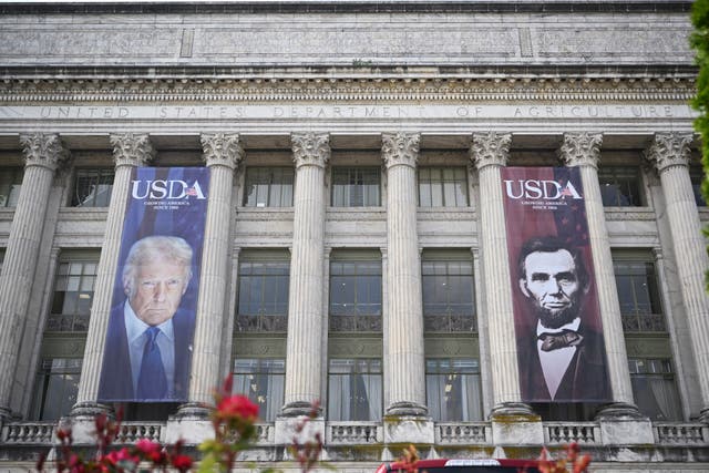 <p>The banners of Trump and former President Abraham Lincoln were put up in May, which coincided with the department’s 163rd anniversary</p>