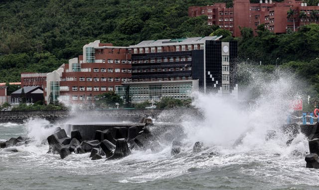 <p>Waves generated by Typhoon Podul break along the coast in Kaohsiung </p>
