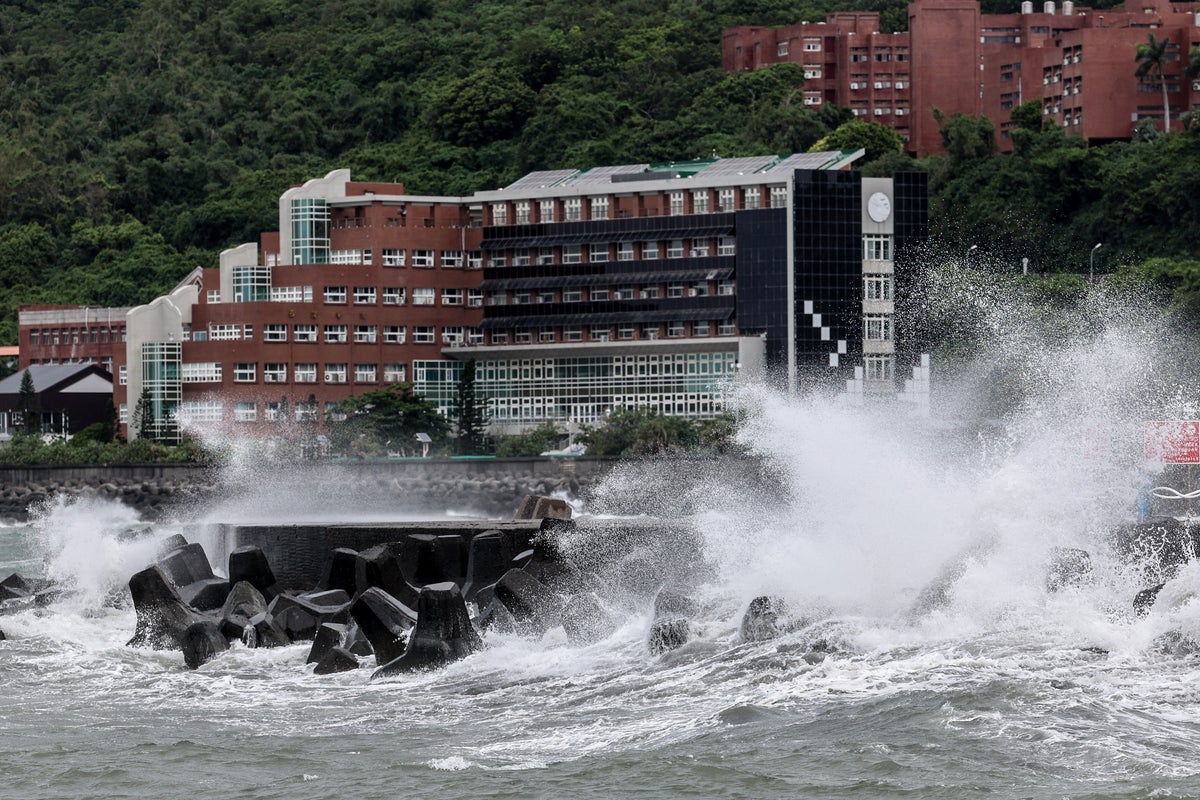 Flight cancellations and evacuations as Typhoon Podul makes landfall in Taiwan