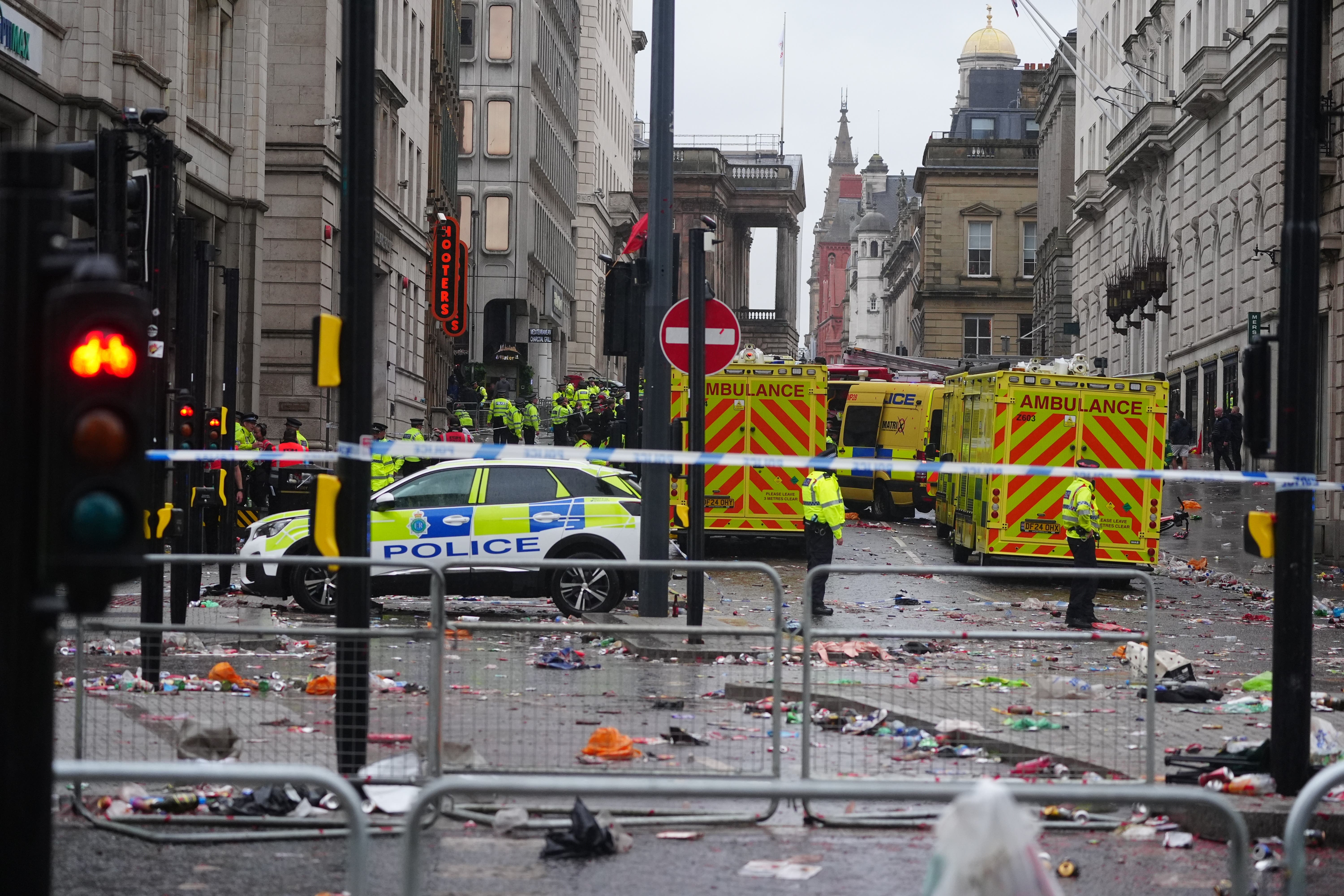 Police and emergency personnel after the crash on Water Street following the Liverpool victory parade crash (Owen Humphreys/PA)